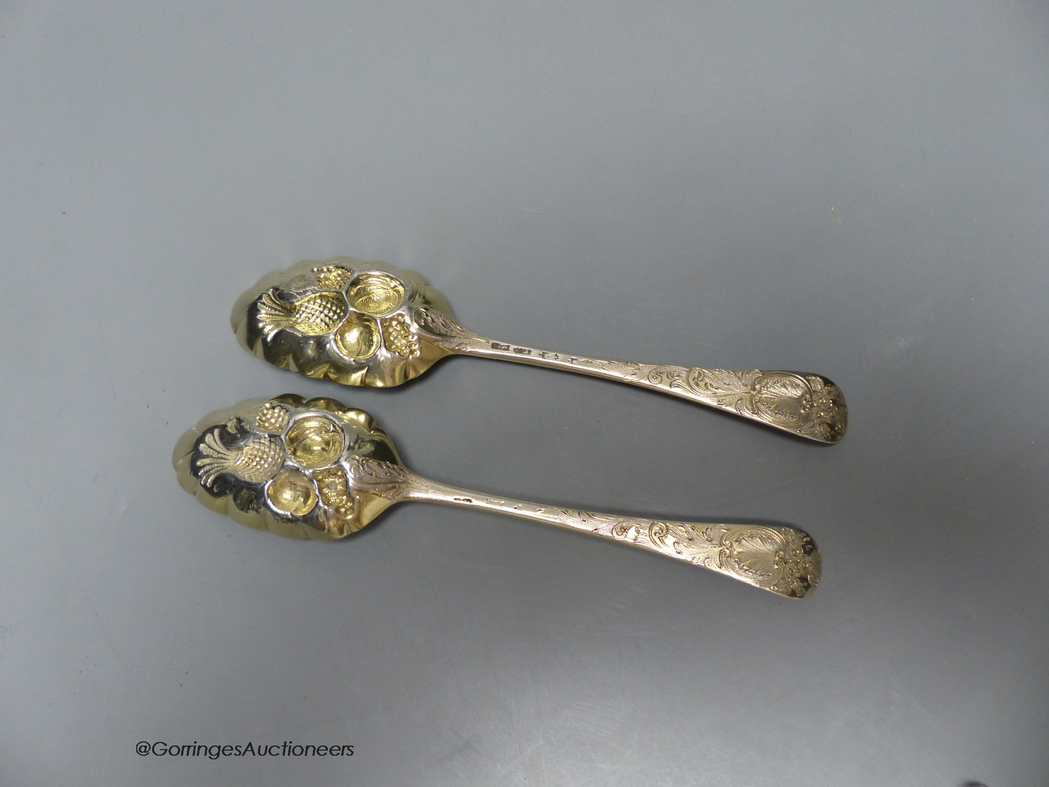 A pair of 18th century silver 'berry' spoons by Ebenezer Coker (marks rubbed and pinched), 19.8cm, 126 grams.